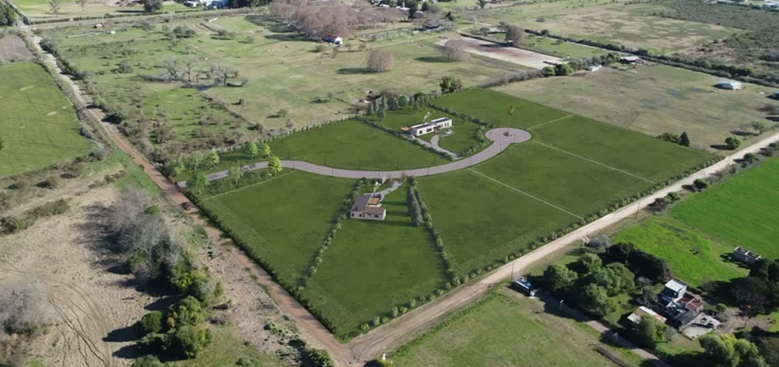 Vista aérea del predio de Pueblo Escondido con la calle interna y la rotonda